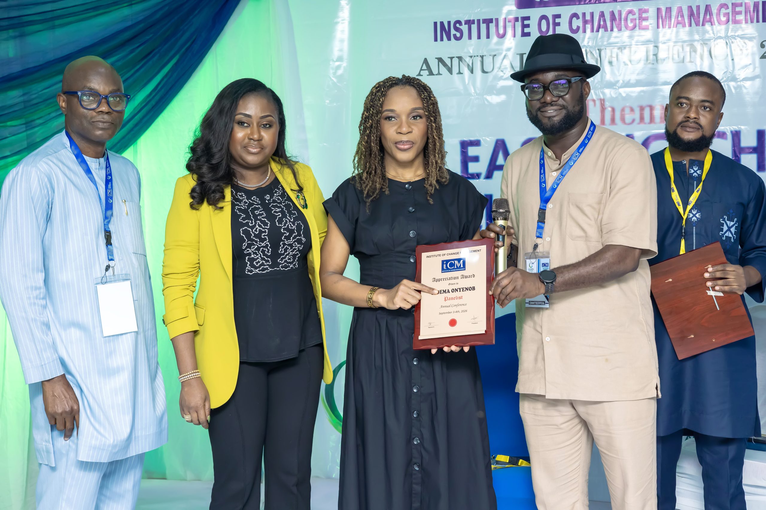 Ijeoma receiving her plaque