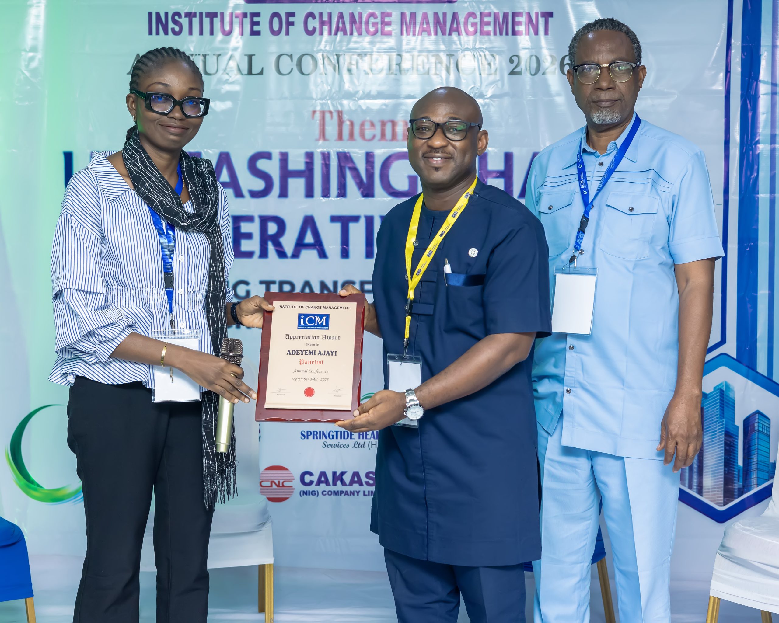 Yemi Ajayi Reciving his Plaque